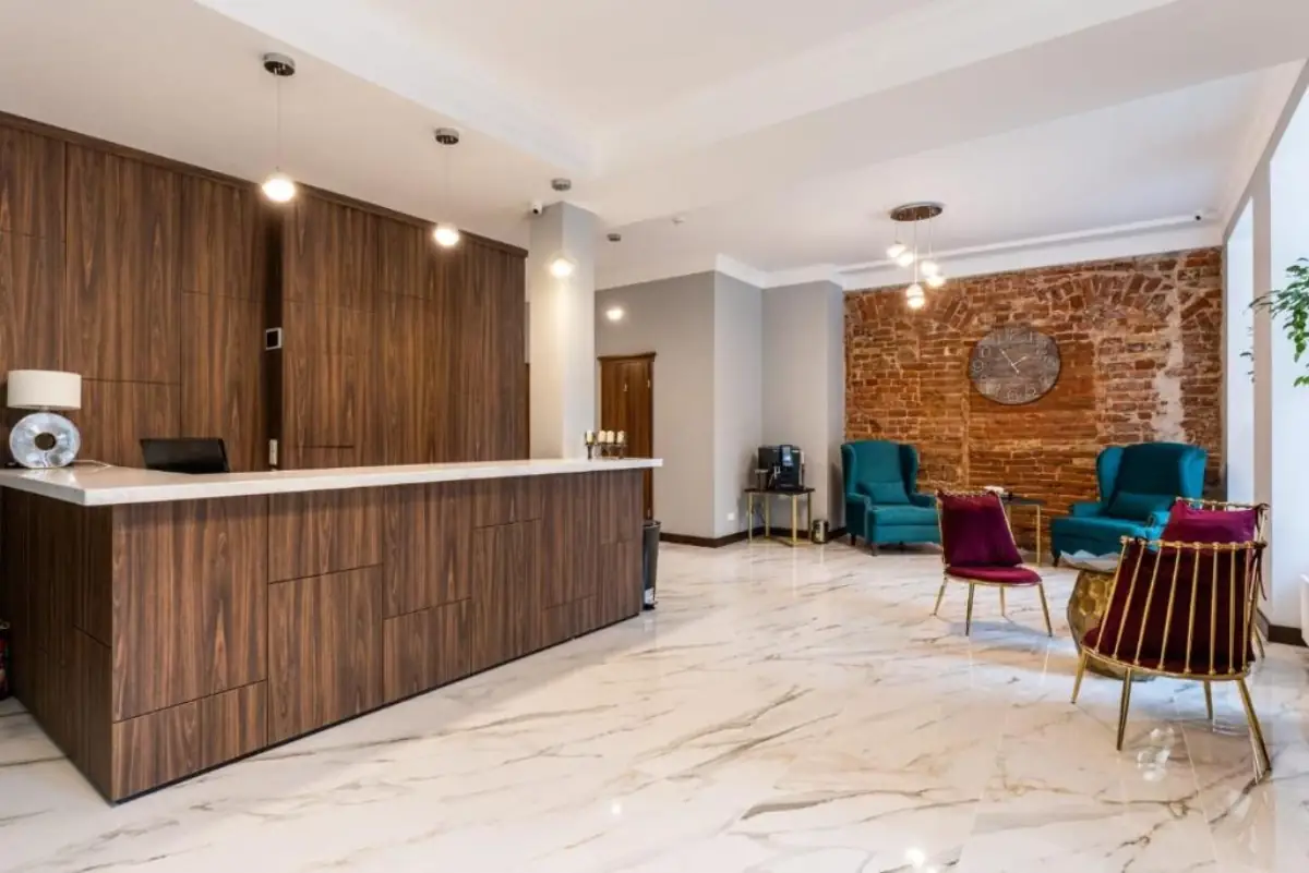 Old Riga Plaza Hotel lobby with reception desk and brick wall lounge