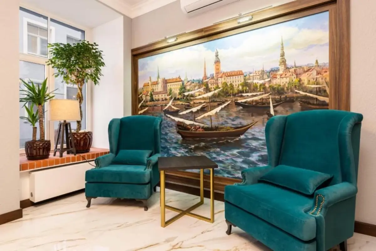 Old Riga Plaza Hotel lounge with painting of old Riga and velvet armchairs